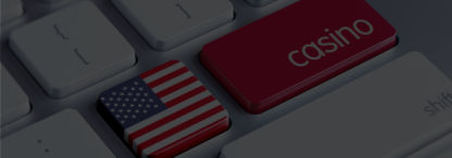 A close-up of a keyboard with the American flag on 1 key and ‘casino’ in white on a red background on an adjacent key