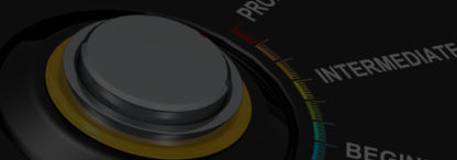 A silver knob with the words beginner, intermediate and proficient on a dark background
