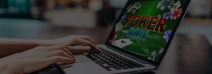 person playing poker online on her laptop
