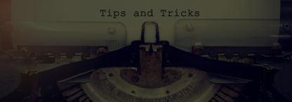 A photo of a vintage typewriter with a piece of paper loaded and the words ‘tips and tricks’ typed on it