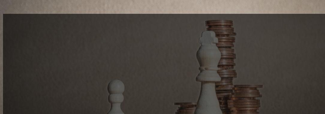 A photo of a white chess pawn with a few coins and a white king with stacks of coins on a light brown background